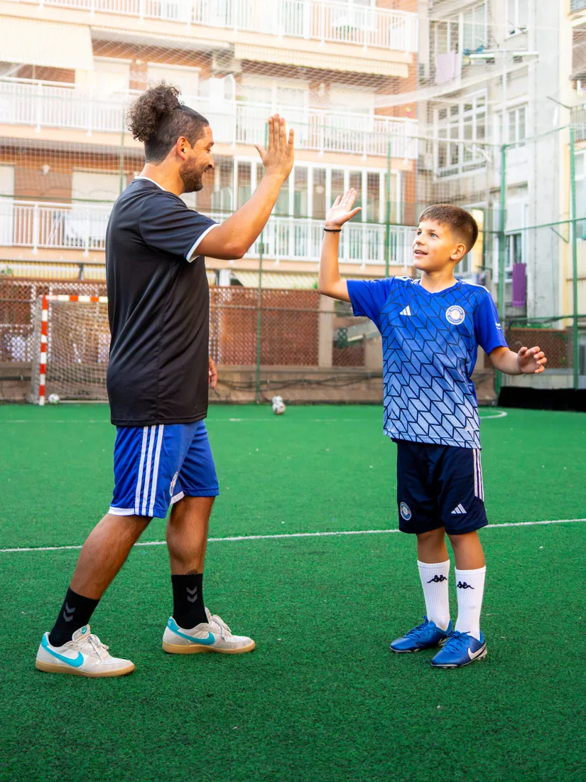 Coach high-five with player